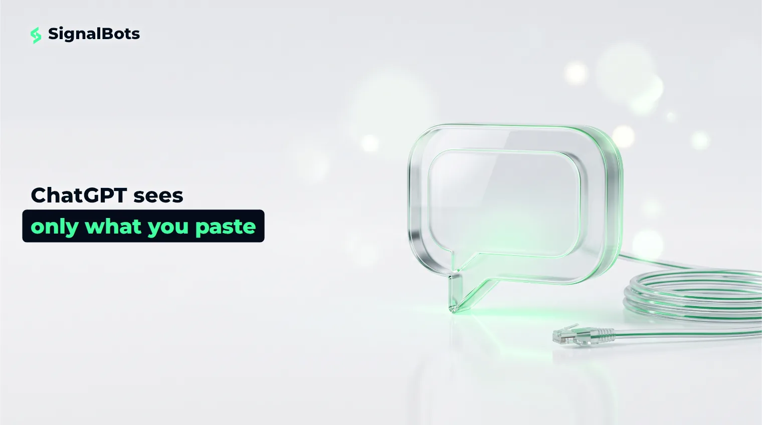 A glass chat-bubble object on a pale surface next to an unplugged data cable, the other end leading out of frame.