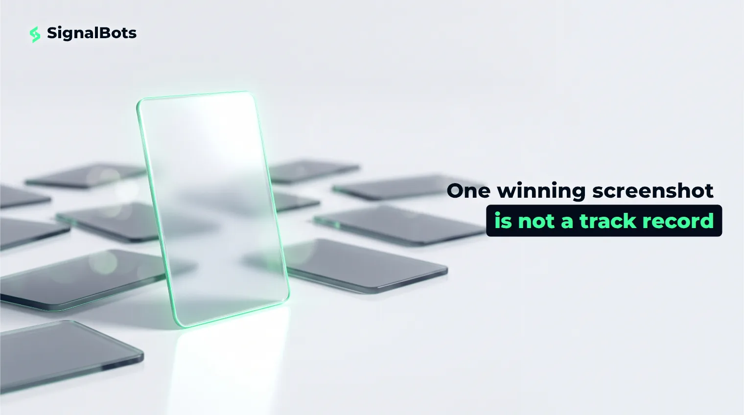 A single brightly lit glass card standing upright in front of many dim, fallen cards on a pale surface.