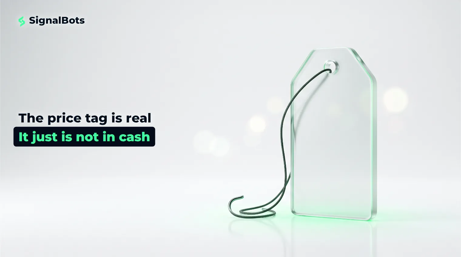 A glass price tag standing on a pale surface with a fine cord looping from it into a small hook.