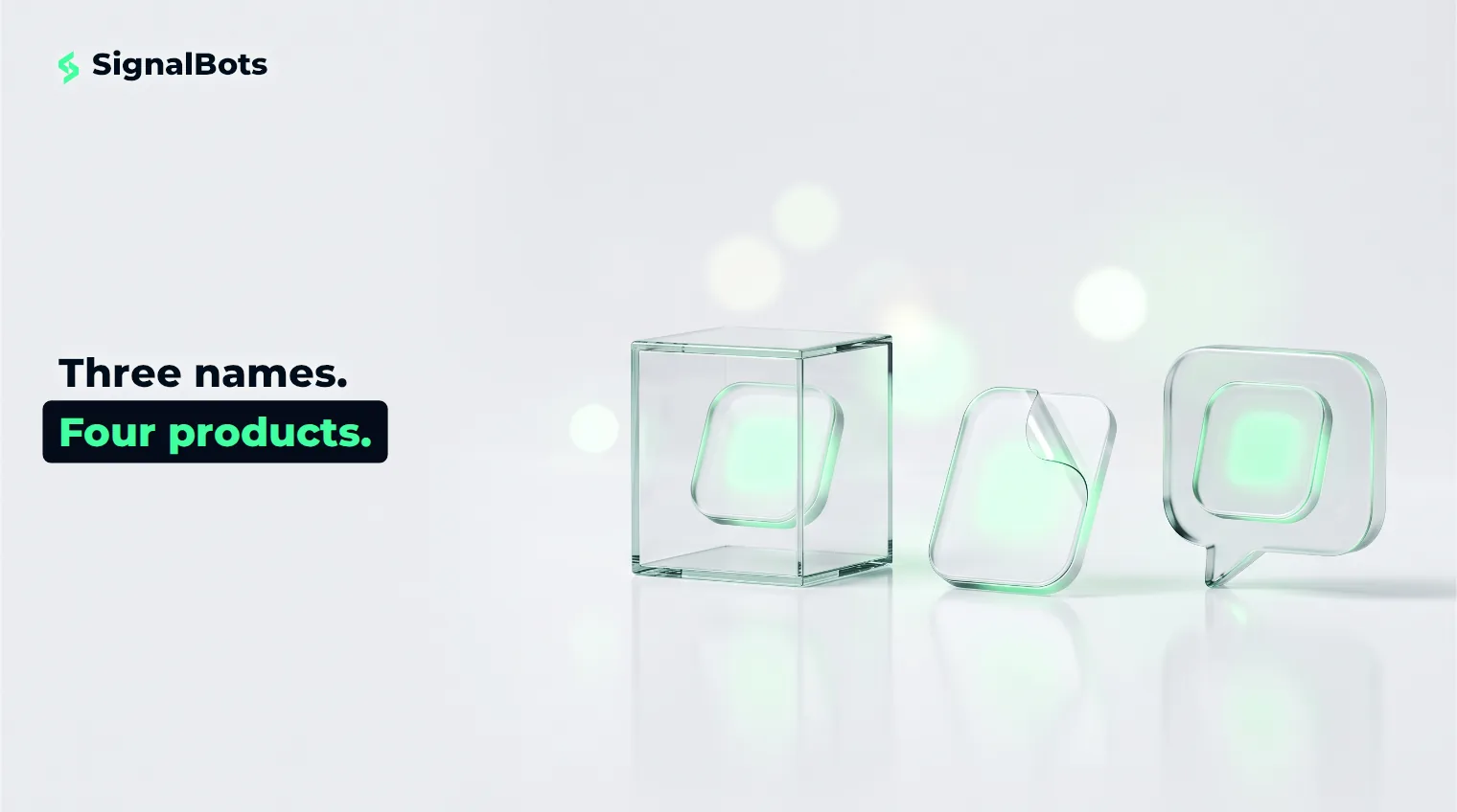 Three identical glass badges on a pale surface, one sealed in a display case, one bare and unwrapped, one inside a glass speech bubble.